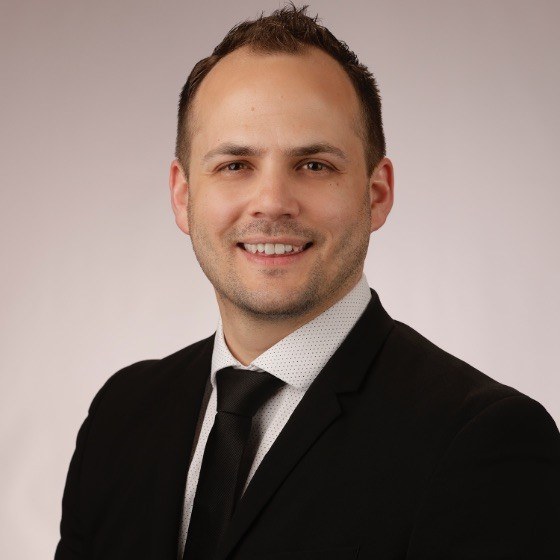 Portrait of Dr. Devan Higginbotham